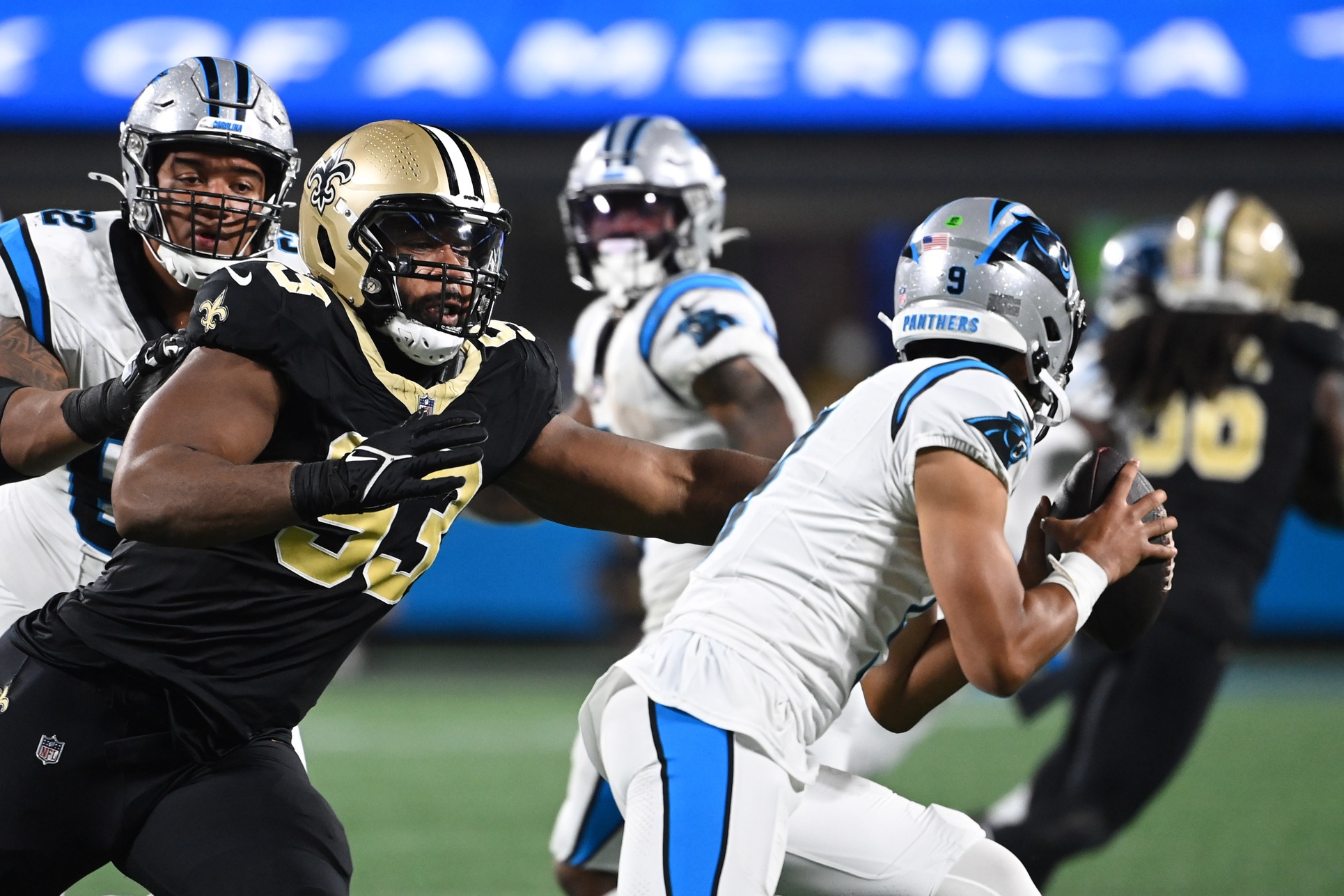 Carolina Panthers quarterback Bryce Young (9) runs as New Orleans Saints defensive tackle Nathan Shepherd (93) pursues. Mandatory Credit: Bob Donnan-USA TODAY Sports